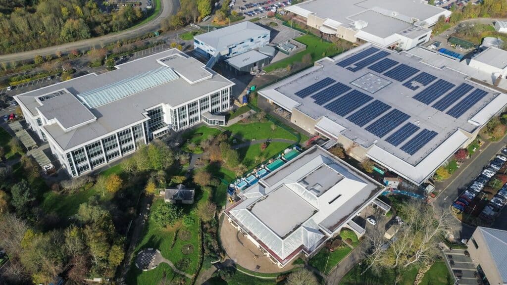 Sustainable AI data center facility with onsite solar farms, battery storage, and green hydrogen generation.
